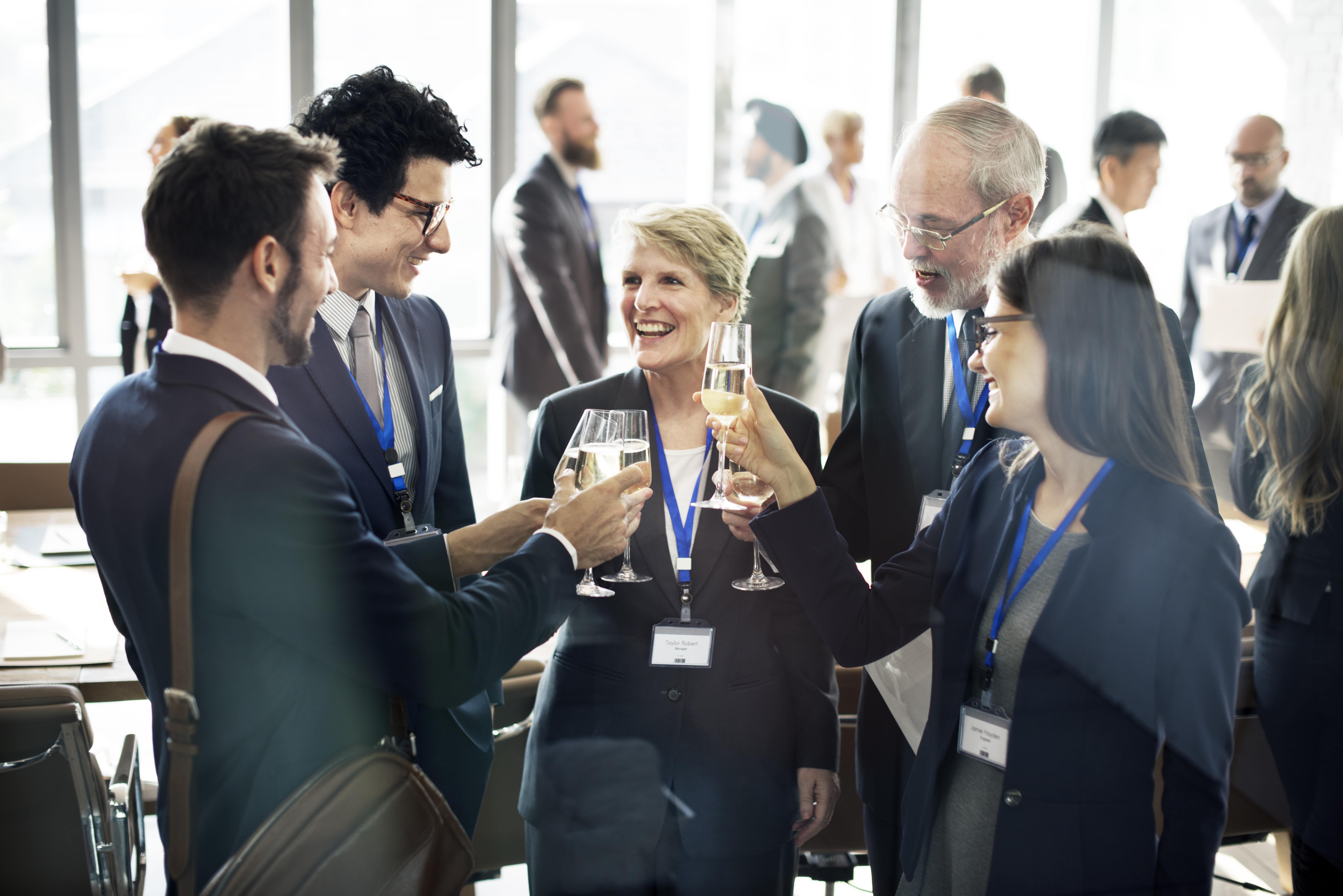 Group of company colleagues making a cheers with champagne